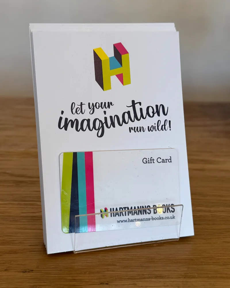 A Hartmanns Books gift card in front of its 'let your imagination run wild' sleeve