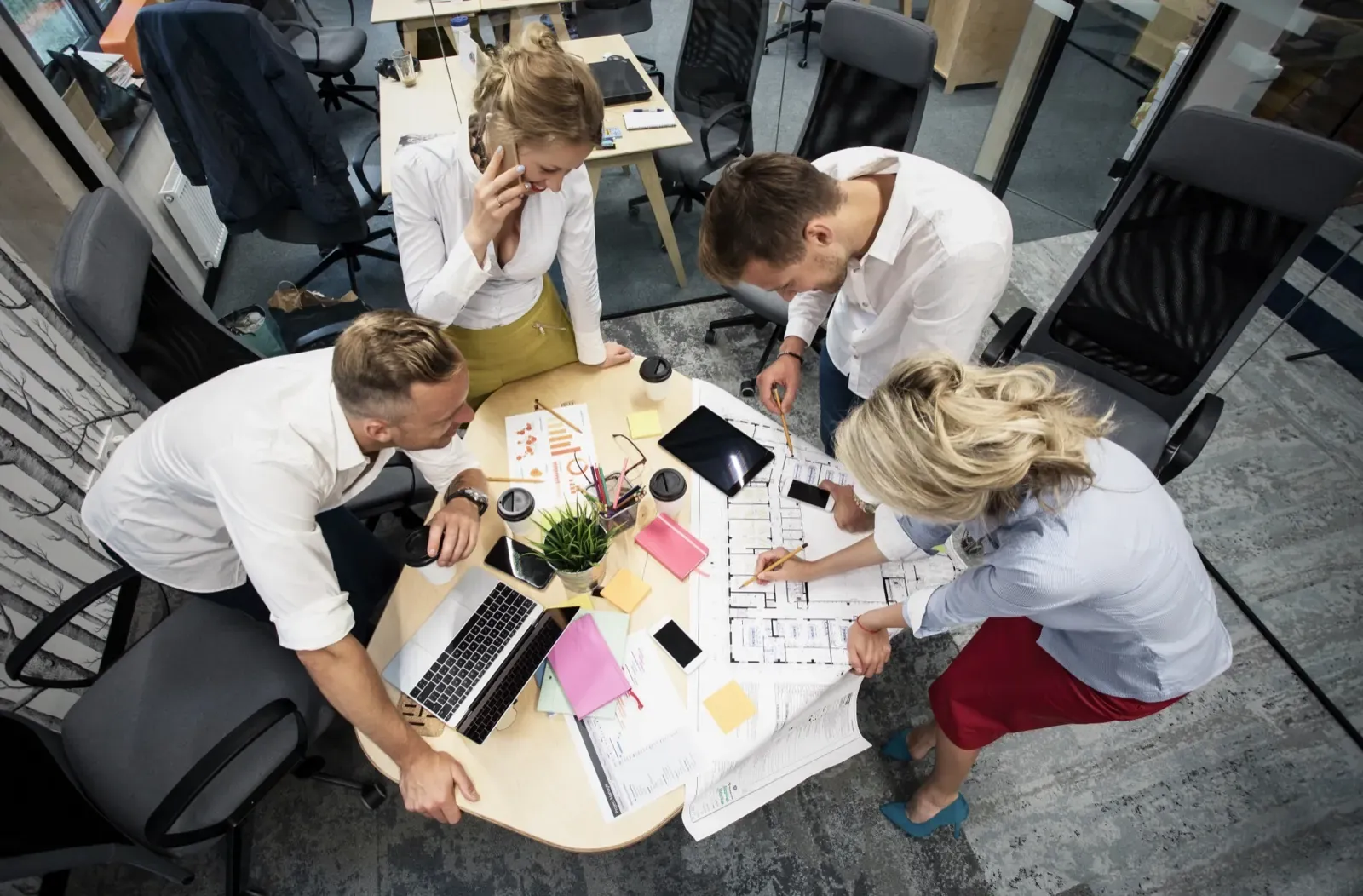 Agency team around a table